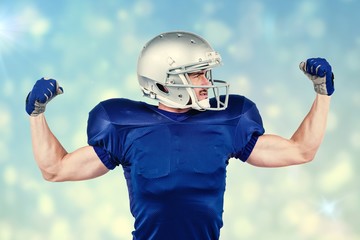 Composite image of american football player flexing muscles