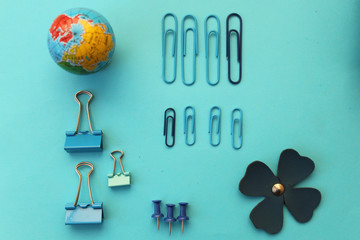 Office supply - globe, binder clip, paper clip and push pin