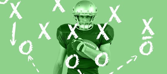 American football player holding ball