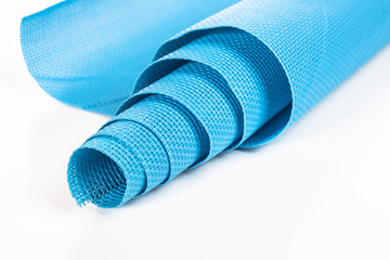 rolled blue napkin on a white background