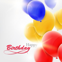 Birthday greeting card with blue, yellow and red balloons.