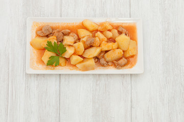 Delicious dish of cooked potatoes with meat