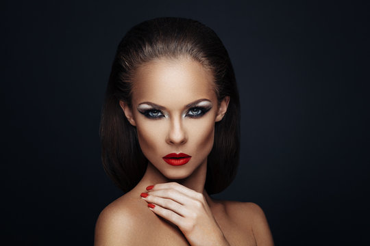 Portrait of beautiful woman with nice makeup and manicure