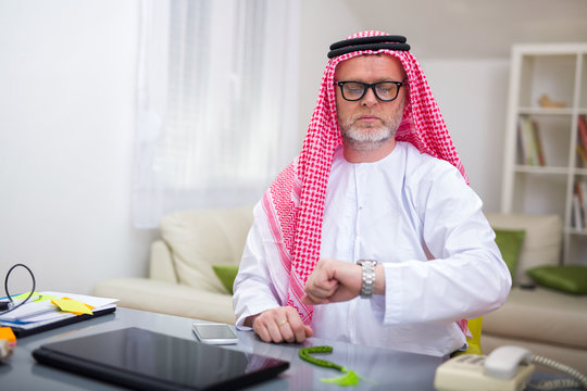 Arabian business man in his home office using computer