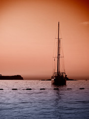 Yacht in the sea at sunset