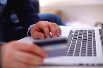 businessman working at a computer hands closeup