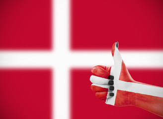 Flag of Denmark on female's hand