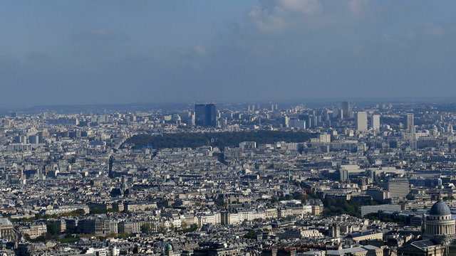 Panoramic footage in 4k with Paris from Montparnasse tower. Aerial view including cathedral Notre-Dame and  different historical and commercial buildings.