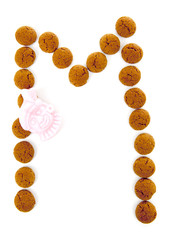Ginger nuts, pepernoten, in the shape of letter A isolated on wh