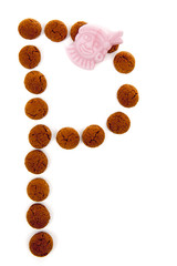 Ginger nuts, pepernoten, in the shape of letter P isolated on wh