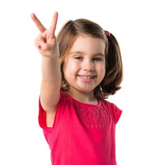 Kid doing victory gesture