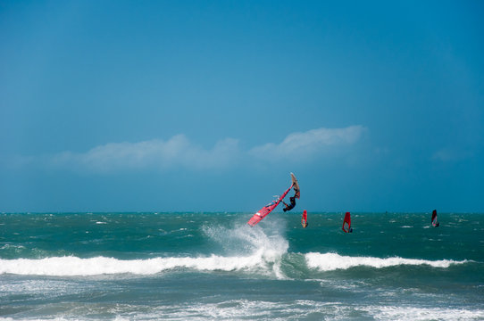 Windsurfer jumps big air on the waves in Atlantic ocean, Jericoacoara, Brazil