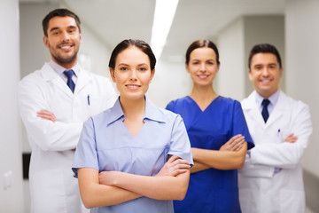 happy group of medics or doctors at hospital