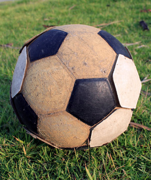 old football on the grass