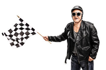 Senior biker waving a checkered race flag © Ljupco Smokovski