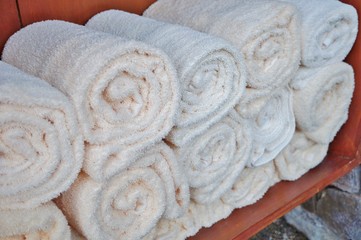 Obraz na płótnie Canvas Clean fresh rolled up white towels