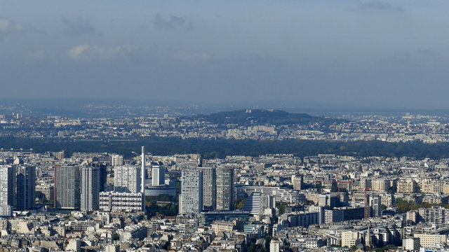 Panoramic footage in 4k with Paris from Montparnasse tower. Aerial view including different historical and commercial buildings like Eiffel tower and La Defense financial district.