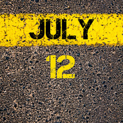 12 July calendar day over road marking yellow paint line