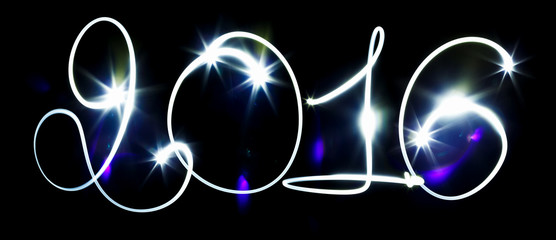 Happy New Year - 2016 made with blue flashlight on a black