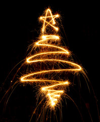 Christmas tree made with sparkler on a black