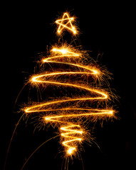 Christmas tree made with sparkler on a black