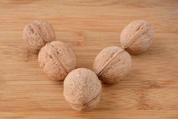 Walnuts on wooden background