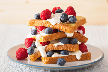 french toasts with creme fraiche and berries for breakfast