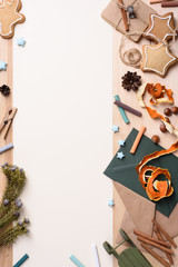 Christmas background with fun rustic decor, envelopes, fir tree, cookies and presents. Top view, copy space.