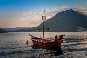 Vintage style small pirate's ship at anchor