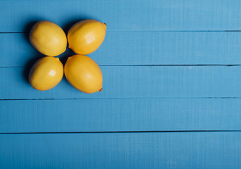 Lemons on blue boards