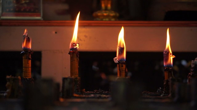 Candles burning in a temple. Abstract step, level and faith and belief in religion background 