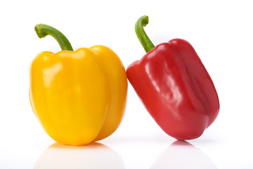 red and yellow sweet peppers isolate white background