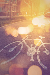 Retro toned bicycle lane mark on the street