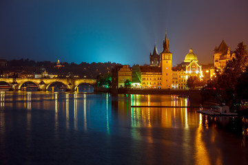 Fototapeta na wymiar Evening over river Vltava near Charles bridge in Prague, Czech