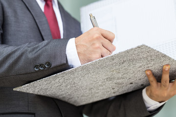 Businessman signing a document