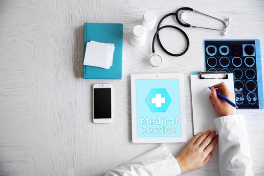 Young woman using his tablet-pc, concept of medical service