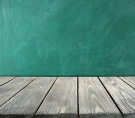 Desk and chalkboard - school background