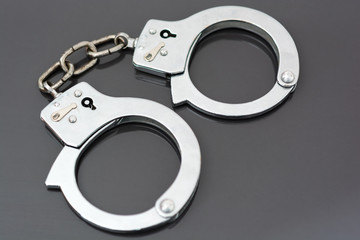 handcuffs on black background