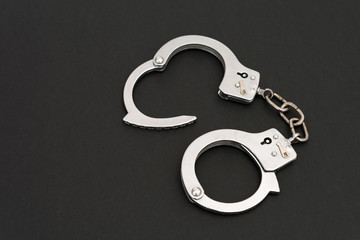 handcuffs on black background