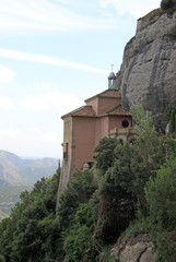 Fototapeta na wymiar MONTSERRAT, SPAIN - AUGUST 28, 2012: Santa Cova Chapel - Cappella della Santa Grotta at the Benedictine abbey Santa Maria de Montserrat, Spain