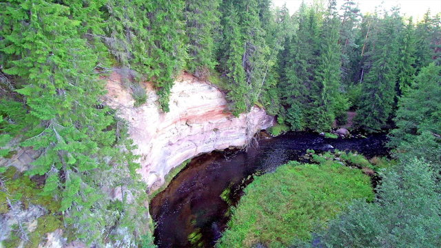 The big sandstone on the mountain in Taevaskoja. Taevaskoja is a village in P&otilde;lva Parish P&otilde;lva County in southeastern Estonia known for its outcrops of Devonian sandstone on the banks of Ahja river.  