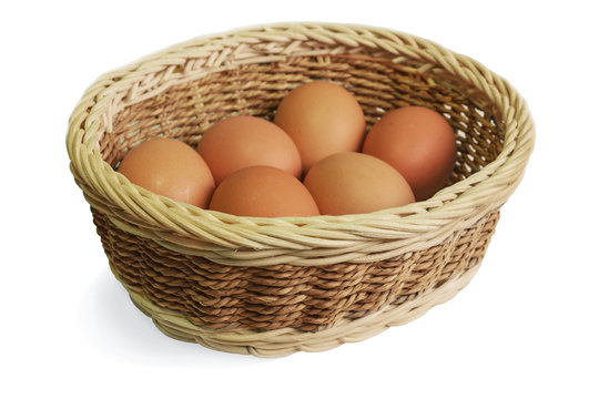 Eggs in a wicker basket on a white background