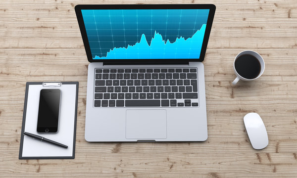 workplace with laptop, smartphone, coffee, notepad