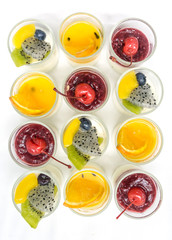 yogurt penna cotta with various fruits topping in glassware
