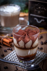 Tiramisu in a glass cup.