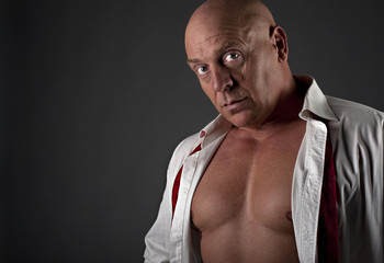 Close up portrait of mature semi dressed male