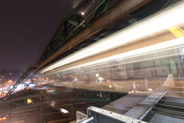 Naklejka premium schwebebahn train wuppertal germany speed blur in the evening