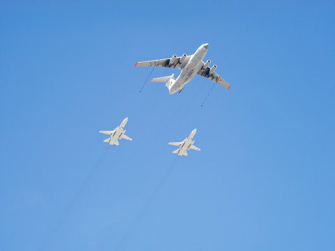 Ilyushin Il-78 (Midas) four-engined aerial tanker demonstrates refueling of 2 Sukhoi Su-24 (Fencer) supersonic all-weather attack aircrafts