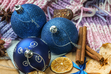 Christmas balls, gift box, winter scarf and dried fruits