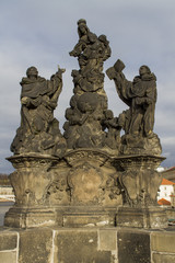 Fototapeta na wymiar Statue of the Madonna, St. Dominic and Thomas Aquinas on Charles